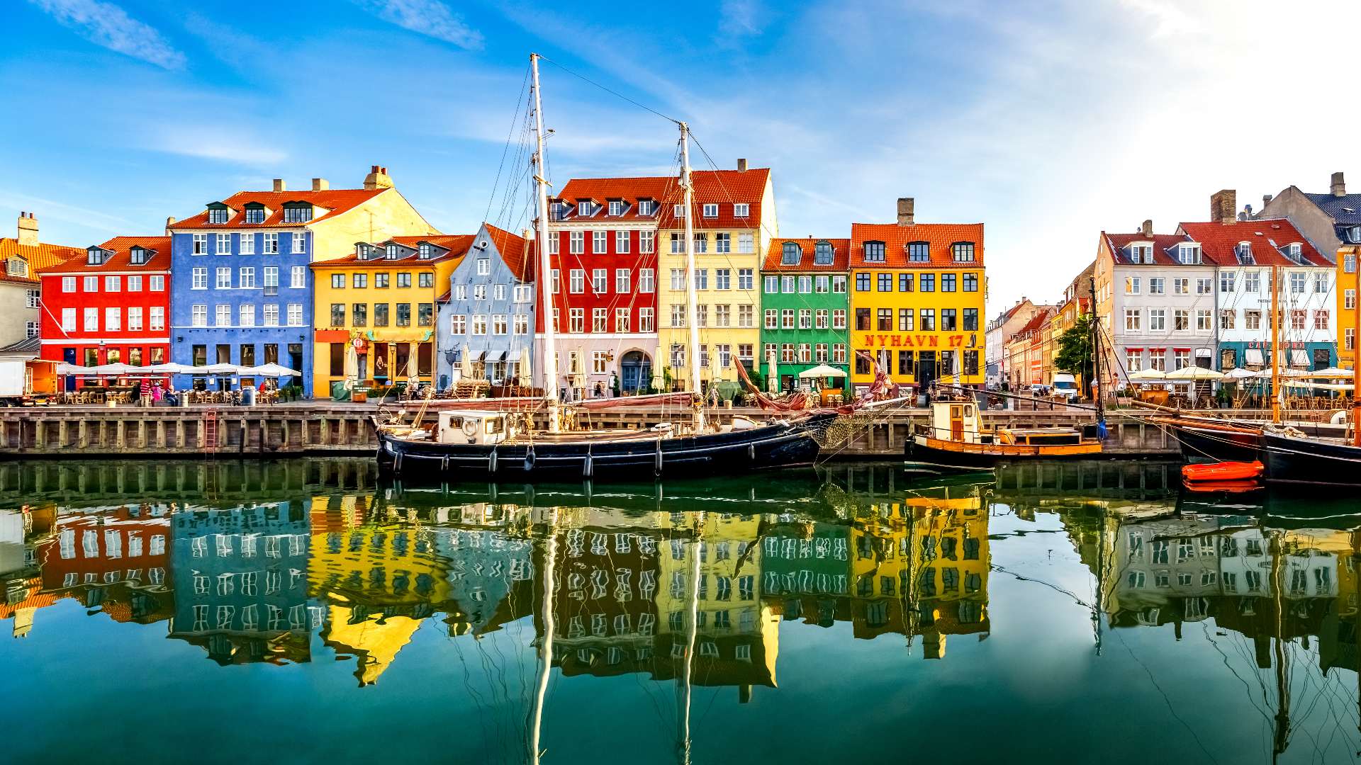 Sunny view of colourful Nyhavn Harbour, Copenhagen, Denmark