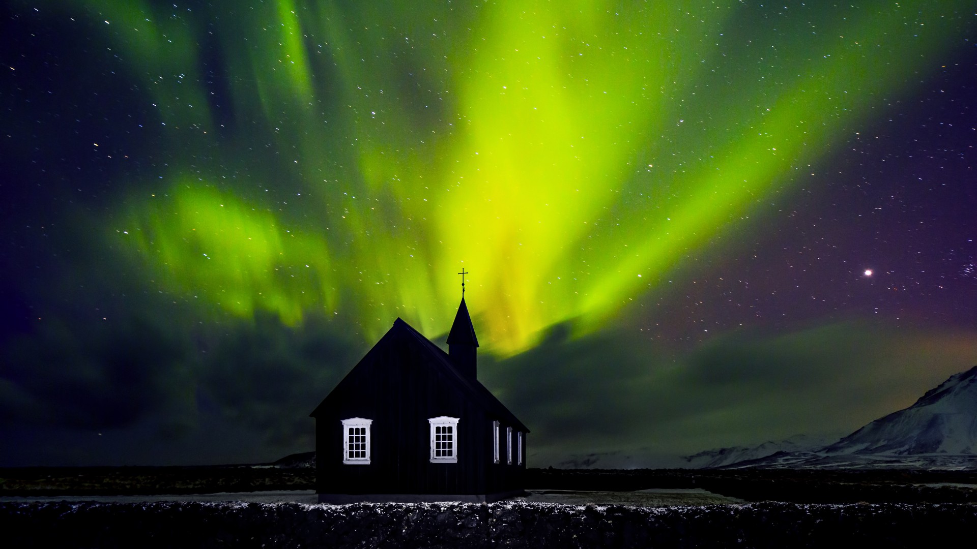 Northern lights over Búðakirkja in Búðir, Snæfellsnes peninsula