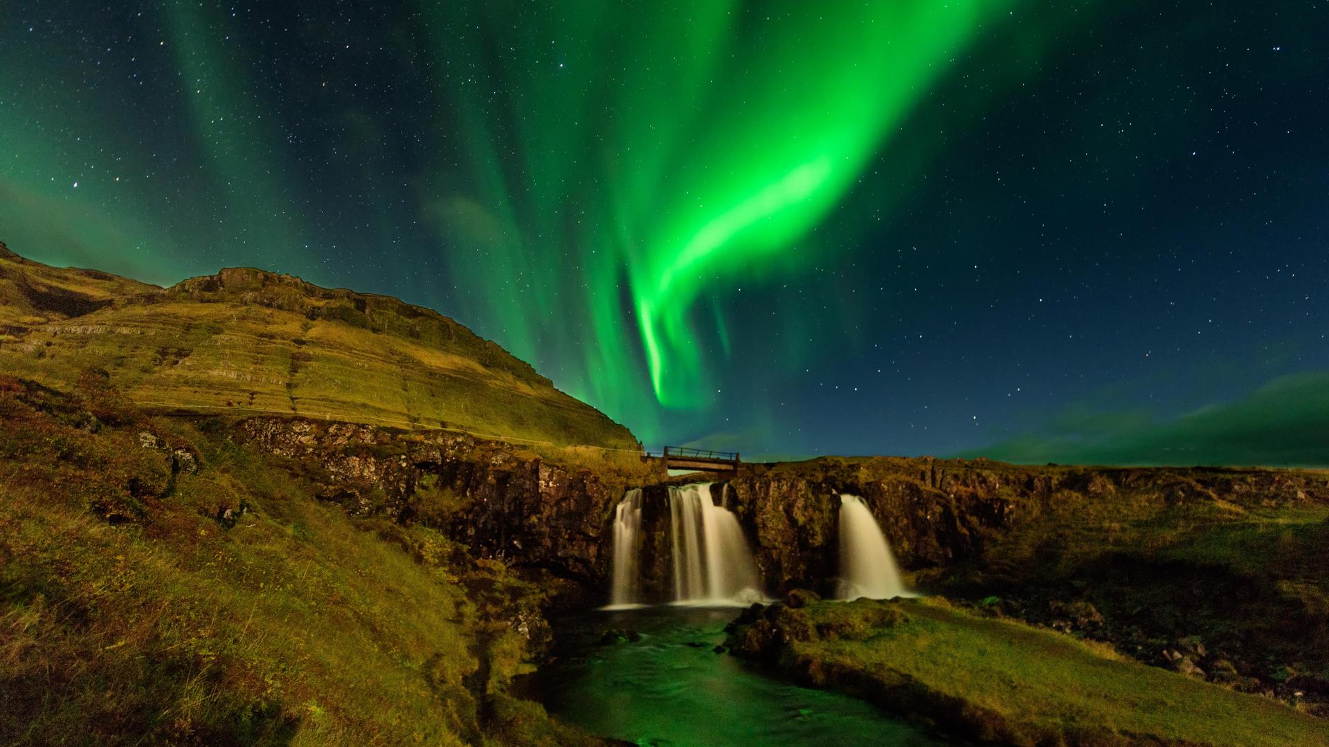 Northen lights over Kirkjufellsfoss, Snæfellsnes, West Iceland