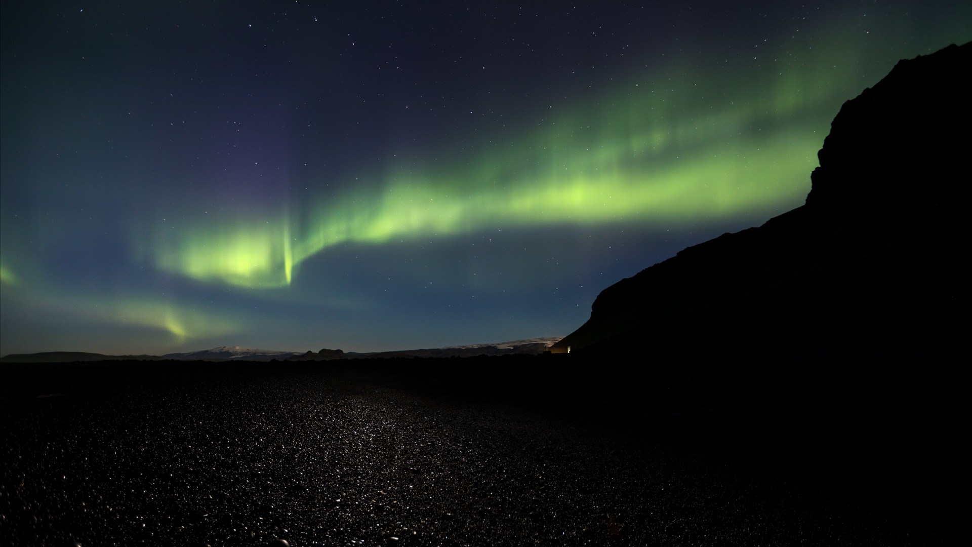 Northern lights above Reynisfjara black sand beach, Iceland 