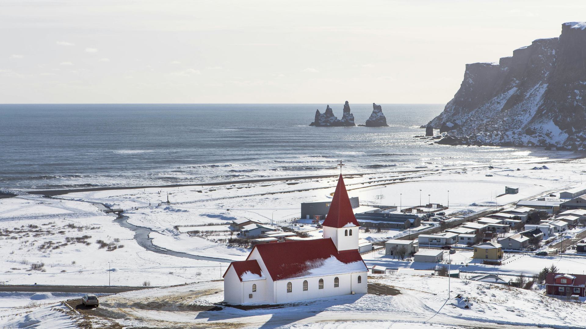 Vik village and Reynisdrangar sea stacks in winter, Iceland