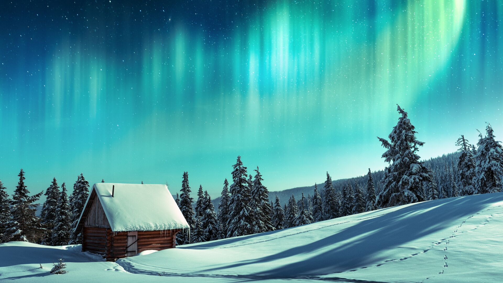 green northern lights above snowy house