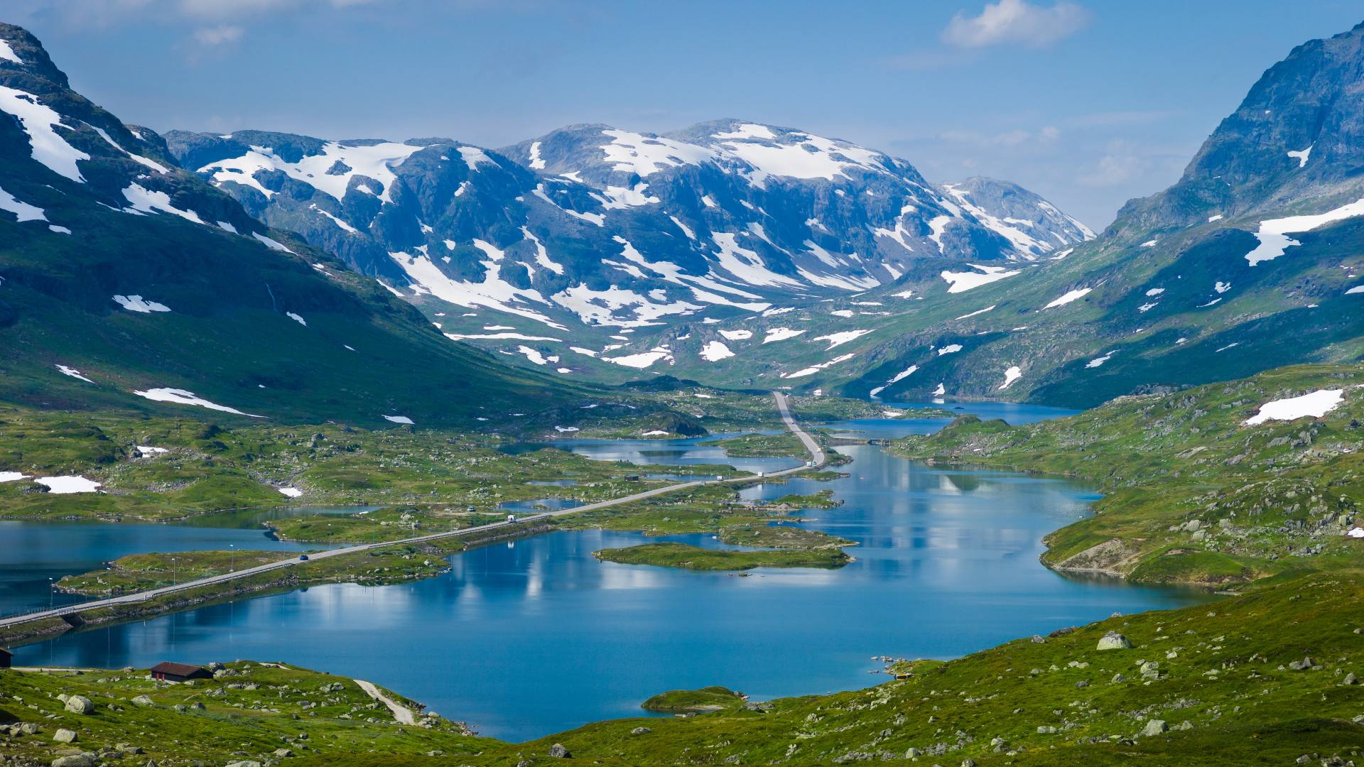  Haukelifjellroad in Norway passing over a lake in an alpine scene