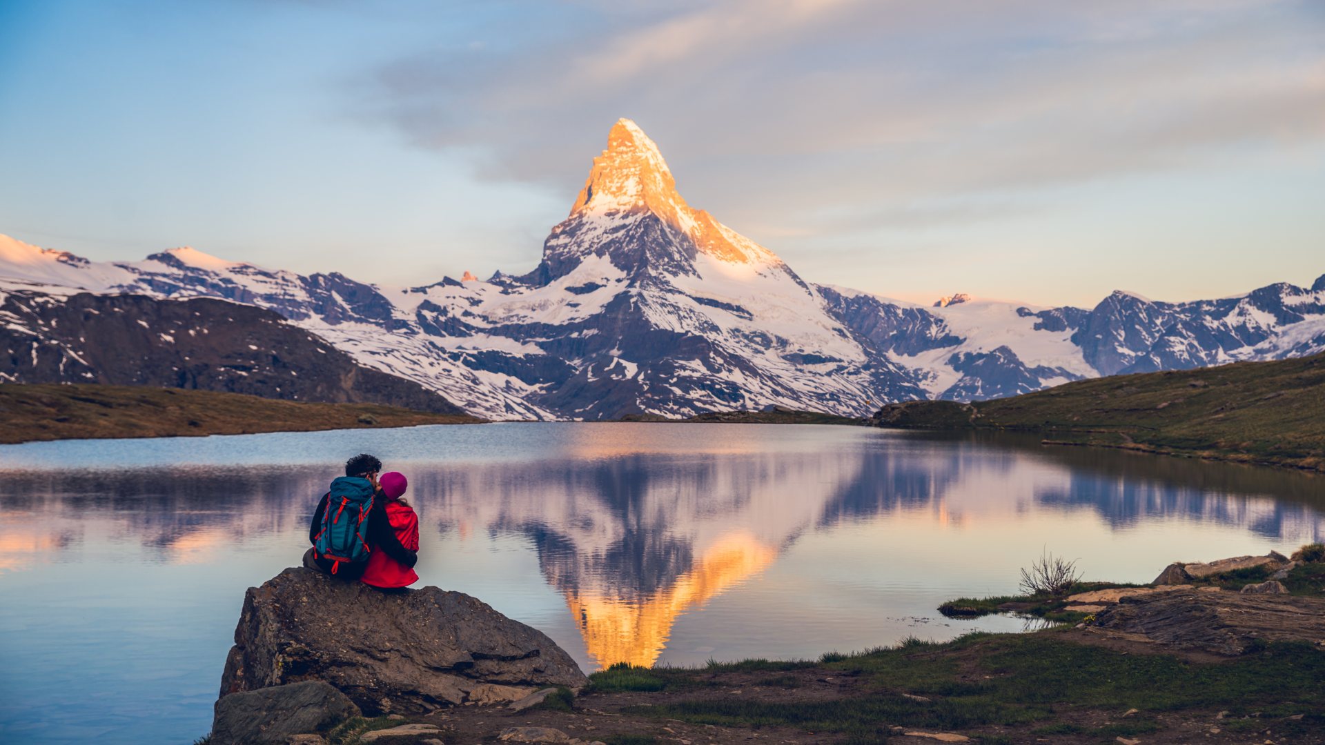 romantic couple at sunrise from lake stellisee swiss alps matterhorn peak